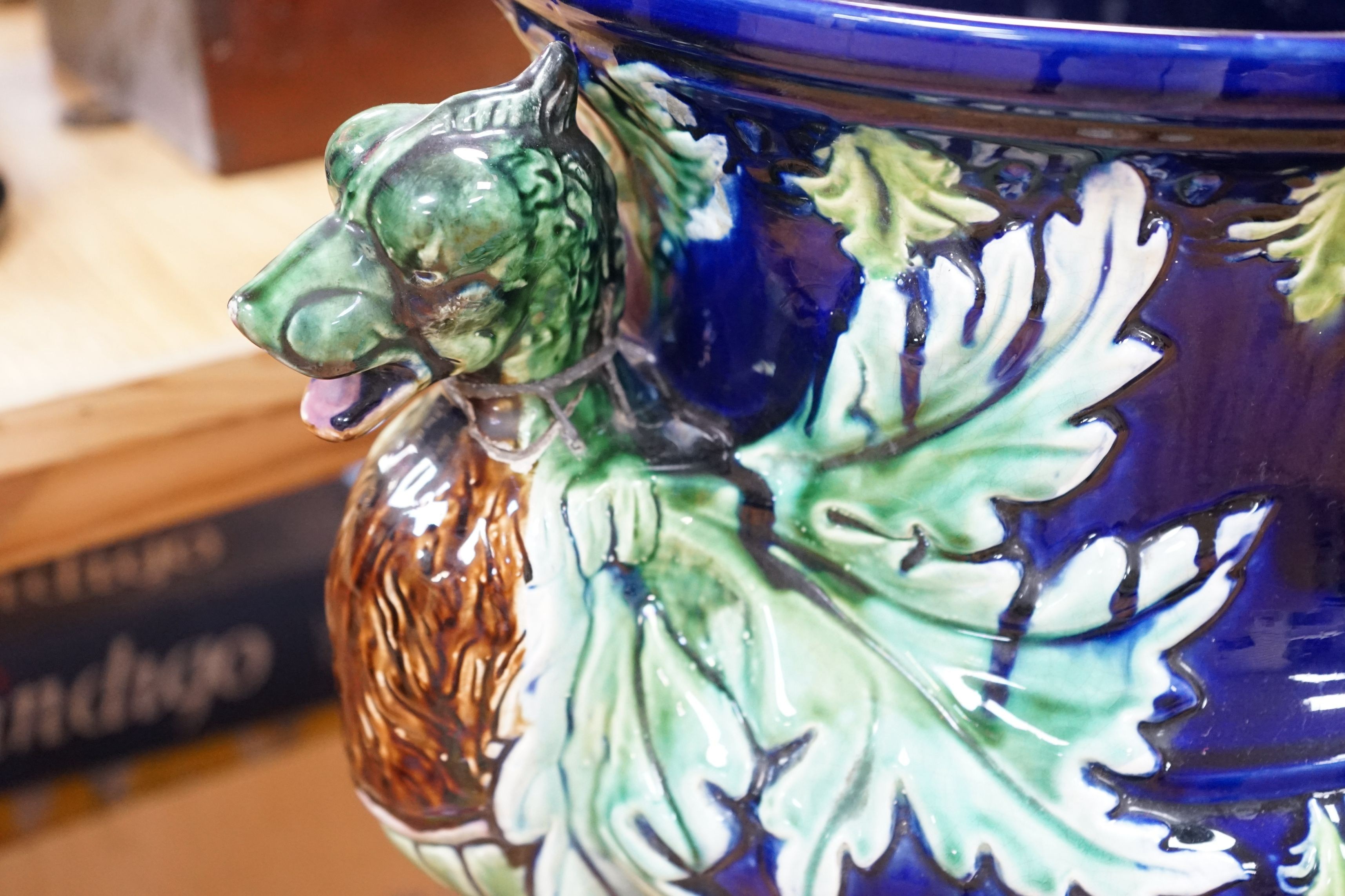 A 19th century majolica jardiniere on pedestal and a two handled jar and cover, jardiniere and stand 99cms high
